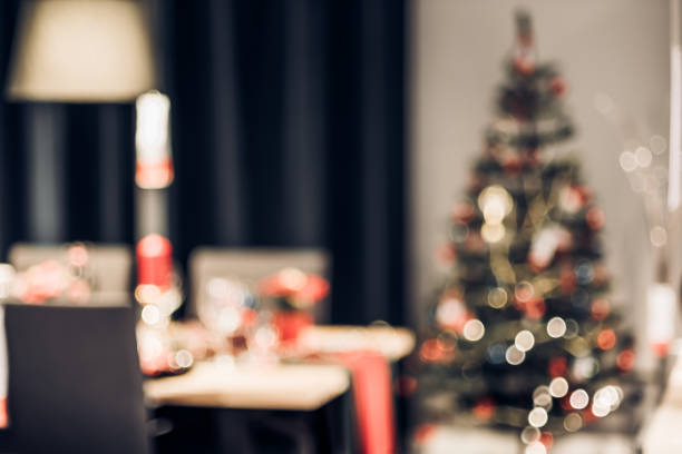 istock abstract blurred Christmas tree decoration with string light at kitchen table in house with bokeh background,winter holiday season celebration festival backdrop. 1181131723