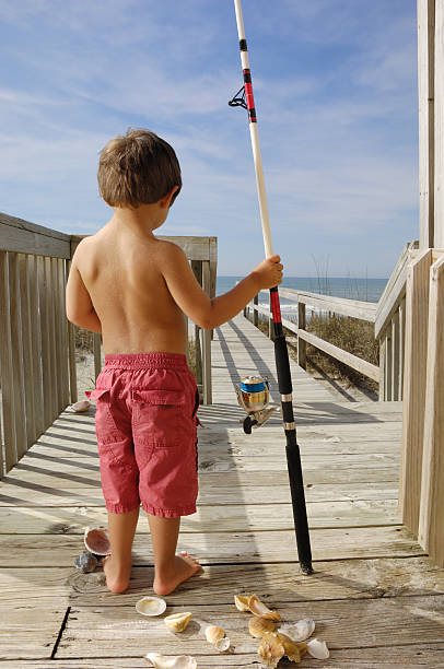 Child ready to go fishing on the beach  emerald isle north carolina stock pictures, royalty-free photos & images