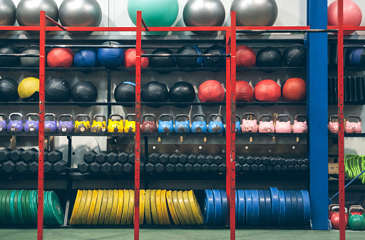 Shelves with sports equipment inside a gym