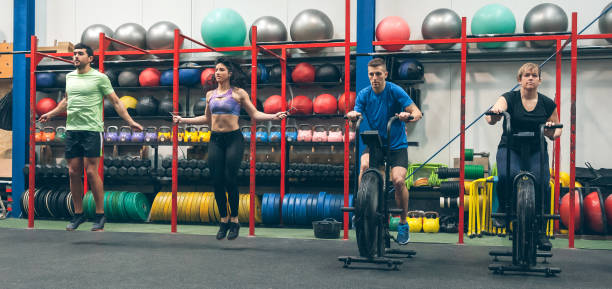 istock Athletes doing air bike and skipping rope 1181147294