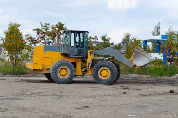 istock backhoe to excavate the soil on the ground.construction site excavator.wheel loader. 1181148169