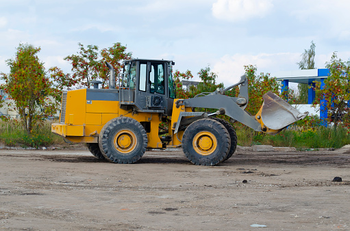 backhoe to excavate the soil on the ground.construction site excavator.wheel loader