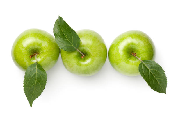 manzanas verdes aisladas sobre fondo blanco - apple granny smith apple green leaf fotografías e imágenes de stock