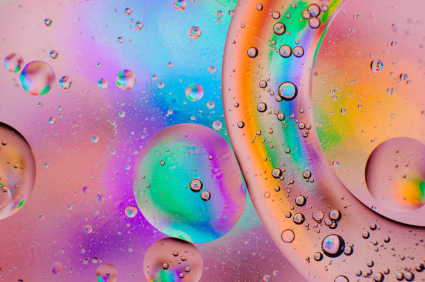istock Abstract iridescent macro background of oil drops 1181149953