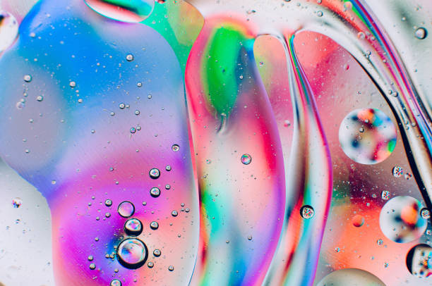 istock Abstract iridescent macro background of oil drops 1181150006