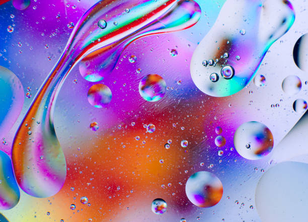istock Abstract iridescent macro background of oil drops 1181150008