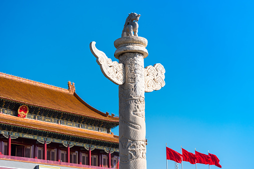 Buildings of Tiananmen Gate, and Huabiao , a marble pillar,traditionally erected in front of palaces and tombs and made from white marble, erected in the Ming dynasty in the 15th century in front of forbidden city, Beijing, China