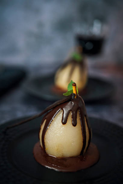 istock Poached Pears in Vanilla Lemon Syrup glazed with Dark Chocolate 1181152432