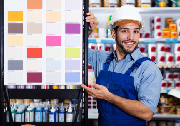 istock Ordinary foreman showing samples of paint 1181152502
