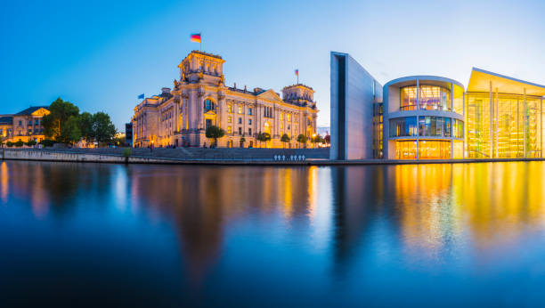 Panoramic View of The German Parliament Building and the River Spree at Twilight, Germany. Reflections in the Still Waters of the Spree River bundestag stock pictures, royalty-free photos & images