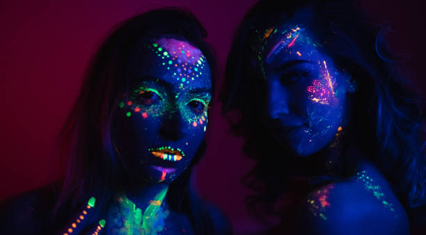 istock Women with fluorescent makeup 1181153883