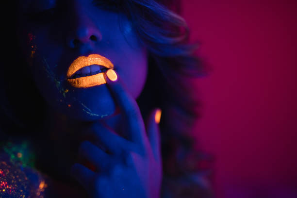 istock Woman with fluorescent makeup 1181153948