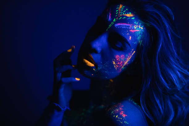 istock Woman with fluorescent makeup 1181154027