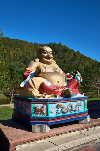 Harrington, Quebec, Canada - September 23, 2018: Main temple of the the Tam Bao Son Monastery and various buddha's statues. Travel in Canada.