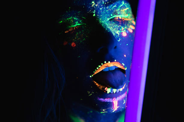 istock Woman with fluorescent makeup 1181154053