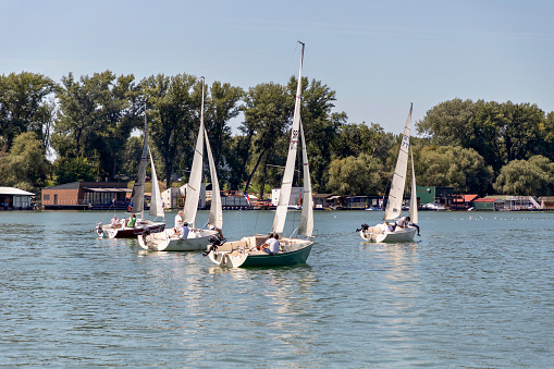 Belgrade, Serbia, August 18, 2019: Young people having fun while recreationally sailing on the Sava River