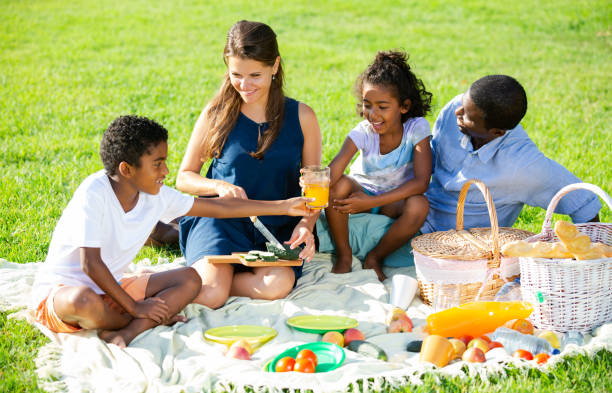 istock Couple with children at picnic 1181155443