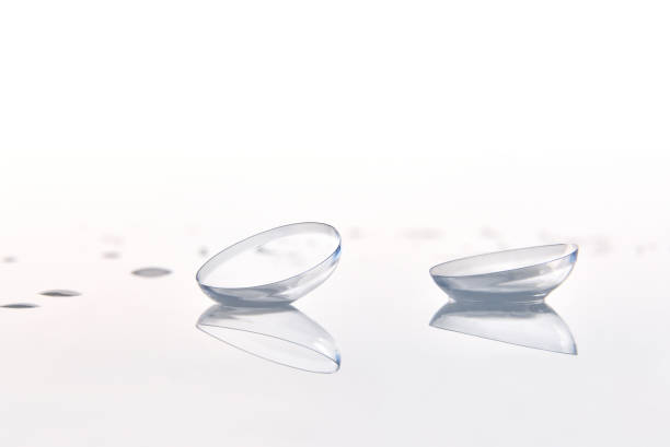 istock Contact lenses macro on glass with white background front 1181156810