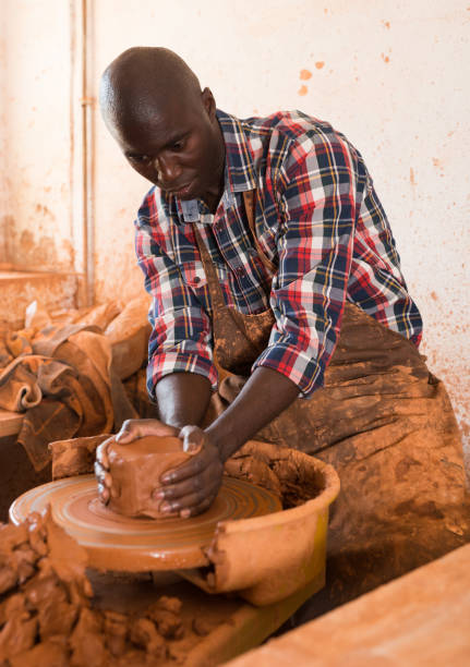 istock Man making ceramics on pottery wheel 1181157638