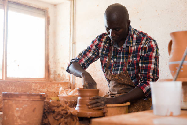istock Man making ceramics on pottery wheel 1181157670