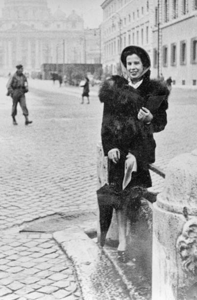istock 1935, Young woman visiting St. Peter, Rome, Italy 1181158012