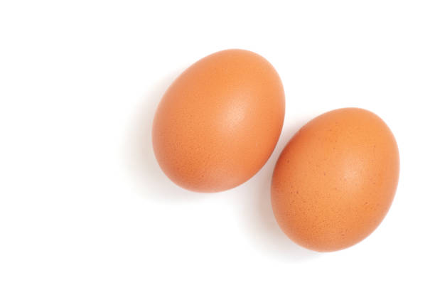 istock two eggs are isolated on a white background. Top view 1181158804