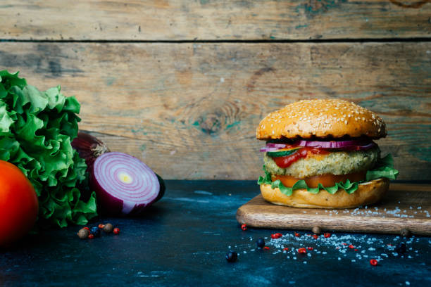 Vegetarian burger (home made burger) with chickpea cutlet and vegetables. Veg concept. Copy space. Vegetarian burger (home made burger) with chickpea cutlet and fresh vegetables. Veg concept. Copy space. veggie burger photos stock pictures, royalty-free photos & images
