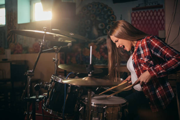 istock Woman playing drums 1181161967