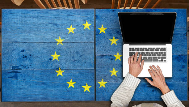 istock Europe flagged wooden Table with laptop 1181162313