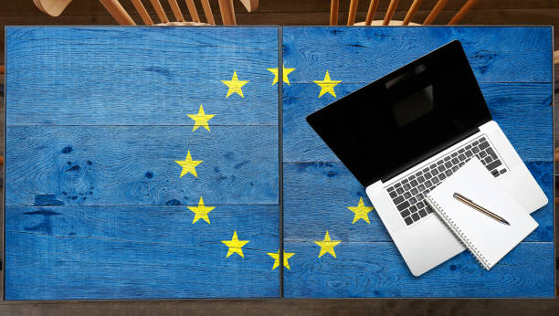 istock Europe flagged wooden Table with laptop 1181165213