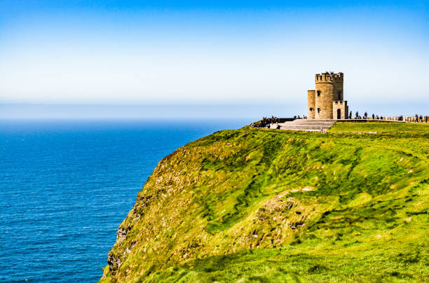 o'brien's tower the highest point of the cliffs of moher on the western atlantic ocean coastline of ireland in the burren region of county clare - republic of ireland cliffs of moher cliff galway imagens e fotografias de stock