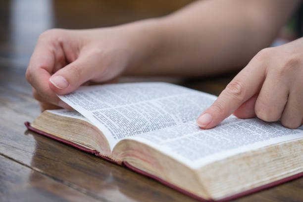 istock Women reading the Holy Bible,Reading a book. 1181168091