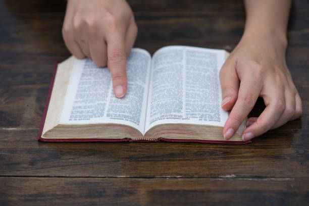 istock Women reading the Holy Bible,Reading a book. 1181168099