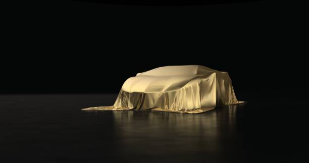 istock Luxury car a covered with a gold cloth 1181171786