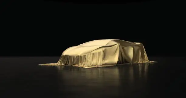 Luxury car a covered with a gold cloth