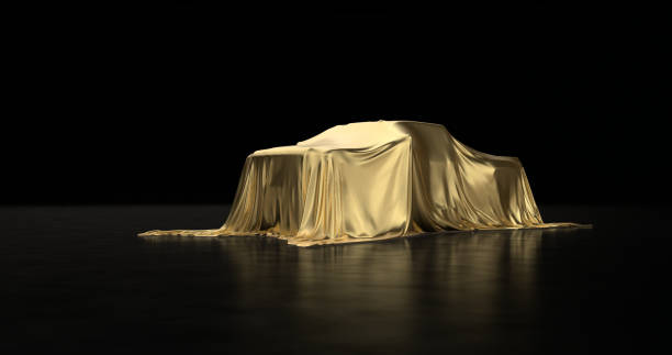 istock Luxury car a covered with a gold cloth 1181171808