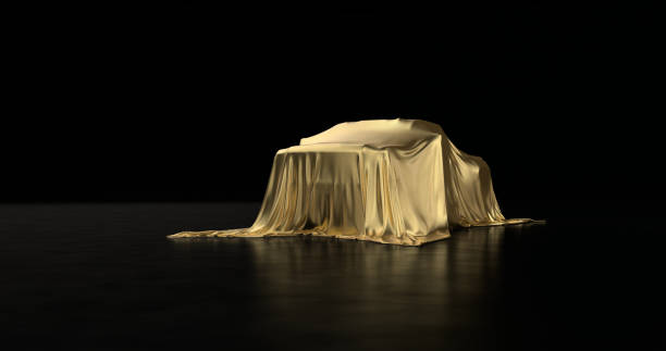 istock Luxury car a covered with a gold cloth 1181171817