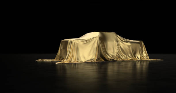 istock Luxury car a covered with a gold cloth 1181171830