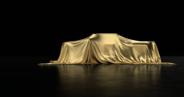 istock Luxury car a covered with a gold cloth 1181171833