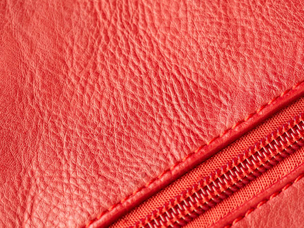 istock Closeup of red leather background with zipper, cope space 1181173616