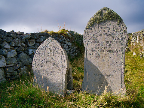 Old graves of the Jamieson family in a remote graveyard near Sandwick on the island of Unst in Shetland, Scotland, UK