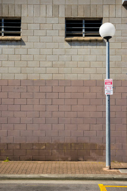 istock Side Factory Wall and Road 1181184402