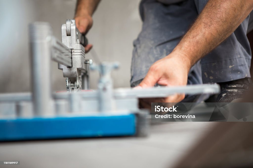 Construction Worker Using Cut Off Machine A Construction Worker Uses A Ceramic Cutting Machine Stock Photo ...