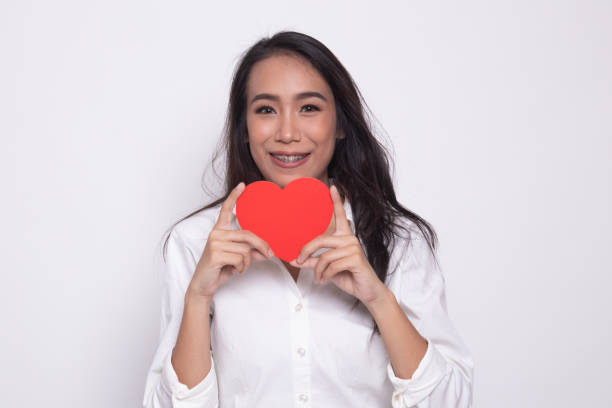 istock Asian woman with red heart. 1181191205