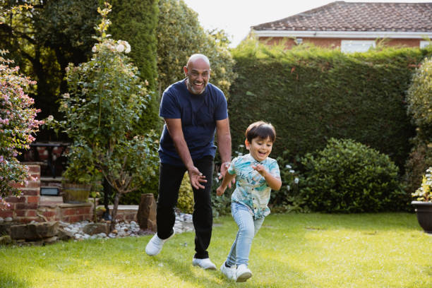istock Chasing Grandson In Garden 1181191785