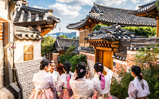 Seoul Korea , 23 September 2019 : Group of Asian tourists girls in traditional Korean Hanbok dressing at Bukchon Hanok village in Seoul South Korea