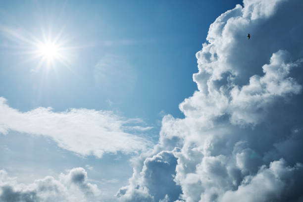 istock Autumn clouds and starburst sunshine background. 1181195376
