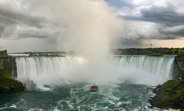 istock Passenger boat sails into Niagara Falls waterfall 1181195578