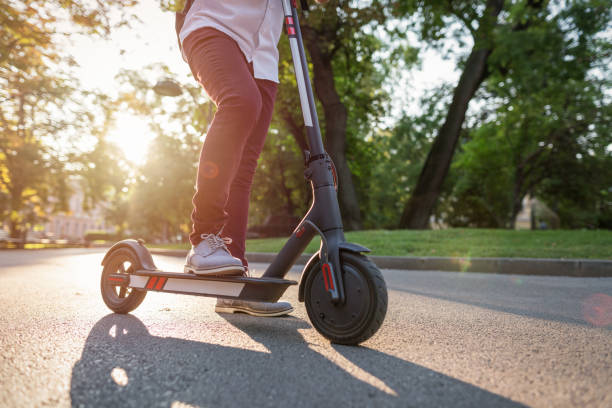istock Man waiting in the park with his e-scooter 1181195701