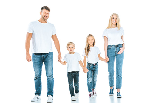 smiling parents holding hands with cheerful kids on white